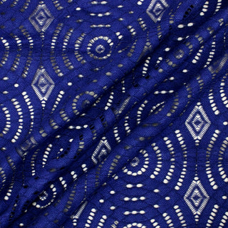 three diagonal lines of indigo colored lace fabric with mandala and diamond motifs throughout