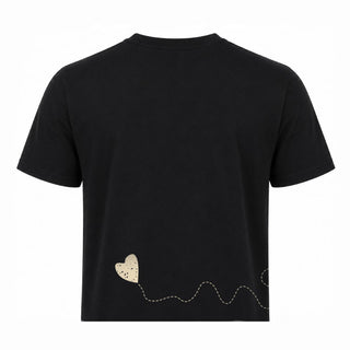 Black cropped-length t-shirt from back with champagne embroidery and a screenprinted heart on it along bottom