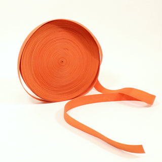 large roll of knitted orange elastic that is 1" wide