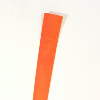close-up of a piece of 1" wide knit orange elastic