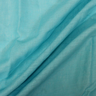 plainwoven slub fabric in a teal color, with three diagonal lines arranged across the fabric's surface to show the hand and drape