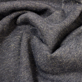 close-up of charcoal grey colored sweatshirt jersey flecked w gold sparkles