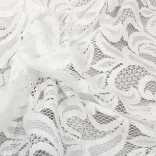close-up of white lace fabric with a netting base and scroll pattern throughout