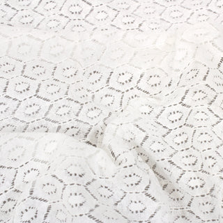 close-up of white geometric patterned lace fabric