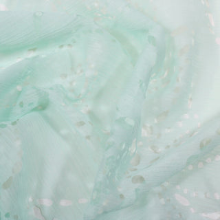 close-up of pale seafoam colored eyelet crinkle chiffon fabric