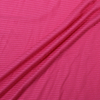 three diagonal lines draped of a hot pink rib knit jersey fabric