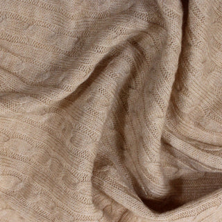 close-up of camel colored novelty rib knit fabric, detailing its knit structure and soft hand