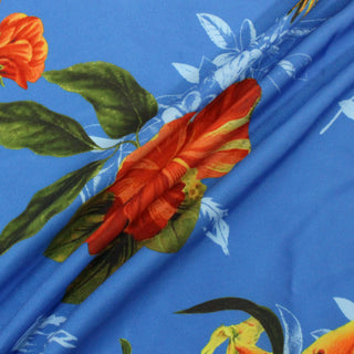 tropical printed fabric arranged in three lines to demonstrate the lightweight drapey hand.