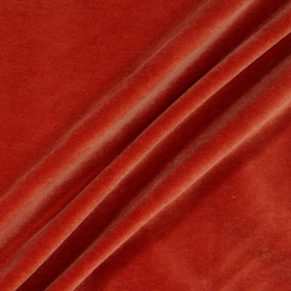 three draped diagonal lines of orange velveteen fabric