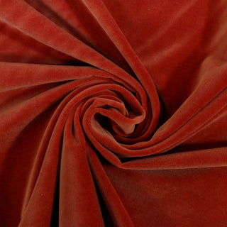 swirl of orange velveteen fabric
