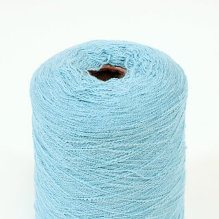 close-up of a cone of aqua blue baby-slub yarn with a fine-gauge and curly texture throughout