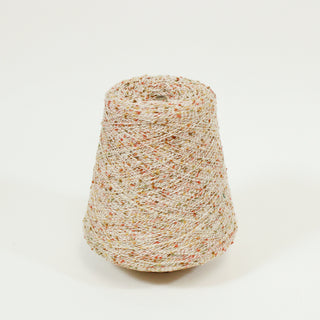 a cone of lace-weight multicolored flecked slub yarn in an autumnal color palette