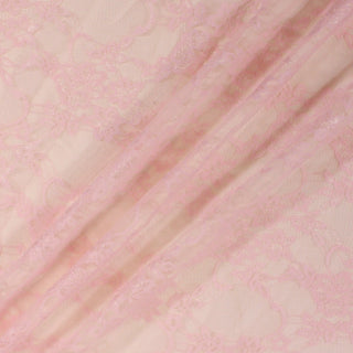 three diagonal lines draped of a baby pink colored trellis-floral lace mesh stretch fabric