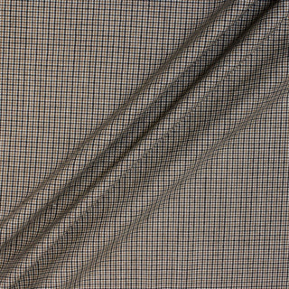 three diagonal lines draped of a beige and black checked lightweight suiting fabric