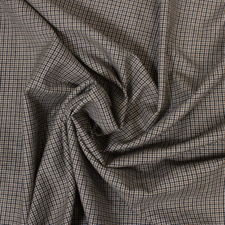 swirl of beige and black checked lightweight suiting fabric
