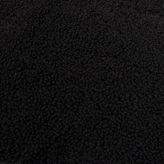 face of black sheepskin shearling hide, short and curly pile