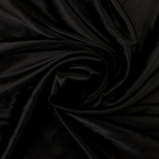swirl of a black silk charmeuse fabric