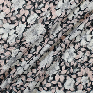 three lines draped diagonally of silk crinkle chiffon fabric with a floral print in black, white, and pale pink