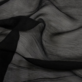 close-up of black crinkle chiffon fabric, detailing its texture