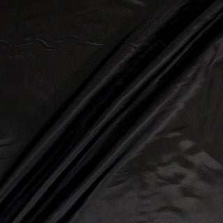 rumpled black cupro fabric, demonstrating the drape and shine