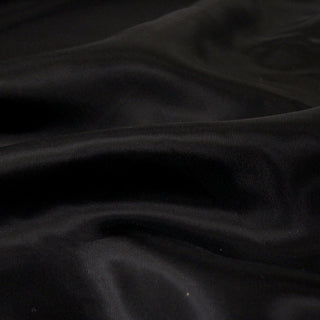 close-up of black cupro fabric showing the weave structure in detail