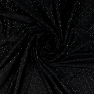 swirl of black interlock fabric that has black diamonds printed on it