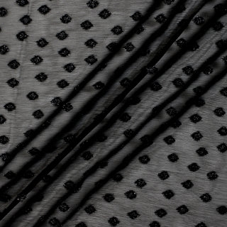 black sparkley-dotted crinkle chiffon fabric with three lines arranged diagonally across its surface to demonstrate the light drape and transparency