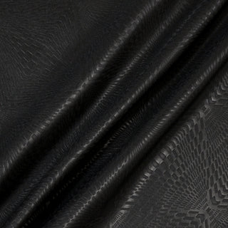 three draped lines diagonal across a black geometric printed fabric 