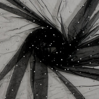 swirl of black mesh fabric with white faux pearl beads