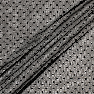 black polka dot mesh fabric with three diagonal lines across it to show the drape and opacity of the fabric