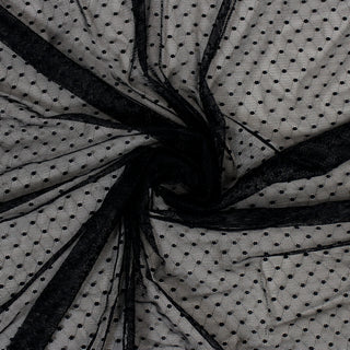 swirl of black polka dot mesh fabric
