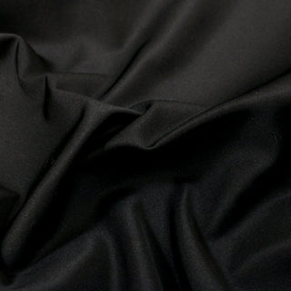 close-up of black satin fabric, detailing its surface and crisp quality