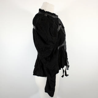 side view of a black suede jacket on a mannequin against a white background