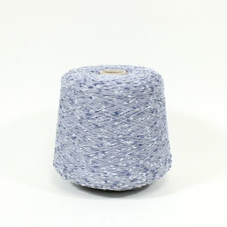 cone of very fine-weight slub yarn in shades of blue