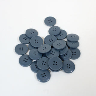 pile of blue plastic buttons