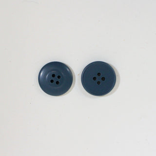 front and back of blue plastic button