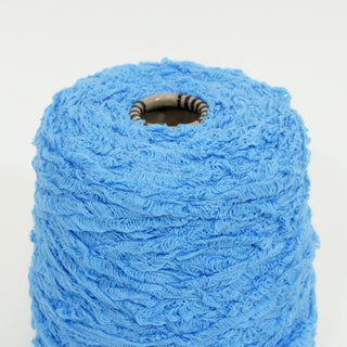 close-up of a cone of blue textured yarn