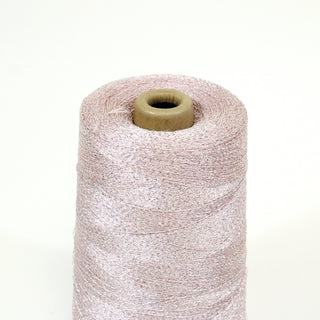 close-up of a small cone of blush/silver ultra-fine yarn