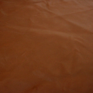 soft face of a brick colored lambskin leather hide