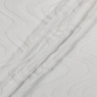 three diagonal lines draped across a bright white knit fabric that has a rippled velour pattern throughout