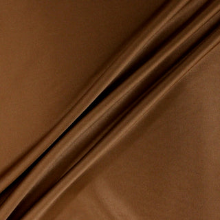 three diagonal lines draped of a bronze colored stretch-silk charmeuse fabric