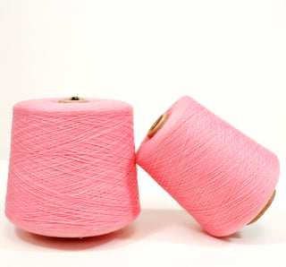 two cones of ultra-fine, luxurious bubblegum pink colored yarn