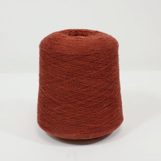 a cone of lace-weight burnt sienna yarn