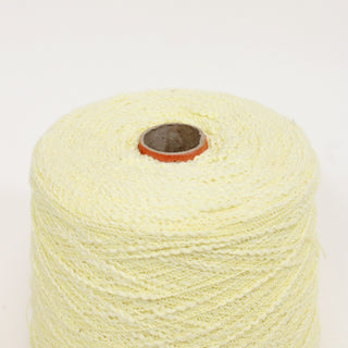 close-up of a cone of butter-yellow curly slub yarn