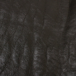 leather side of a double-sided shearling hide, in a deep espresso brown with textured face