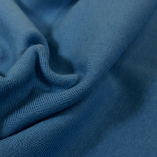 close-up of a cerulean blue 1x1 rib knit jersey fabric, detailing its knit structure