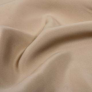close-up of a champagne colored marocaine fabric showcasing the weave structure and hand