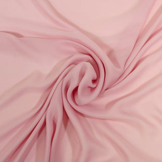 swirl of cherry blossom pink colored silk chiffon fabric, demonstrating its soft hand and impeccable drape