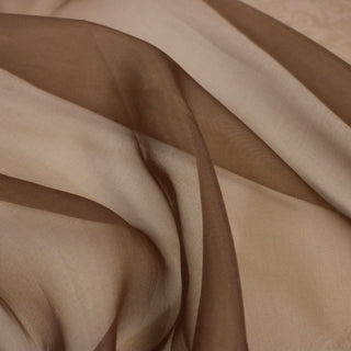 close-up of chestnut brown colored silk organza fabric, detailing its surface