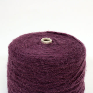 large cone of deep chianti colored bulky, fuzzy yarn